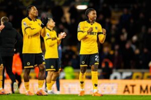 Tawanda Chirewa Celebrates with Wolves teammates 