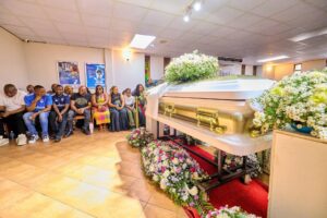 Floral tributes and wreaths laid at the funeral of Evelyn Kujinga.