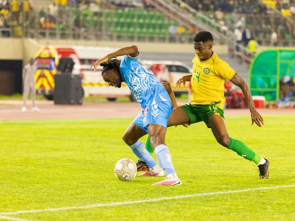 Bill Antonio battles for the ball with DR Congo in AFCON encounter at the National Sports Stadium